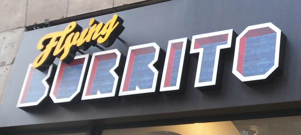 Form cut letters in shopfront signage for Flying Burrito